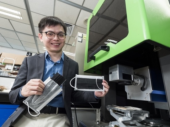 Researcher testing reusable face masks